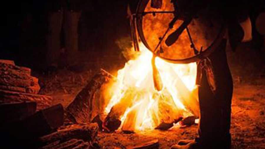 shamanism ritual by a fire