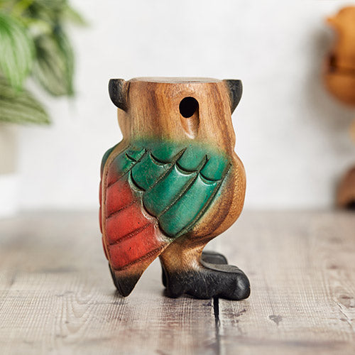 back of large owl wooden flute