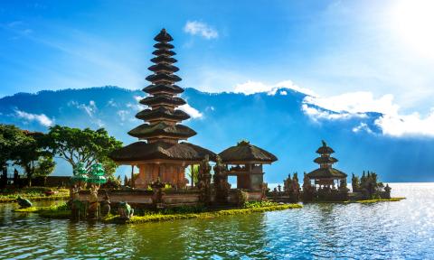 Indonesian Temple with Blue Sky, Water, Trees, and Natural Landscape