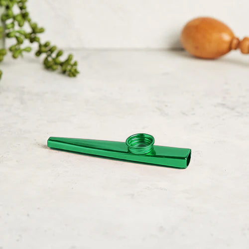 Green Metal Kazoo Flute Whistle on White Background