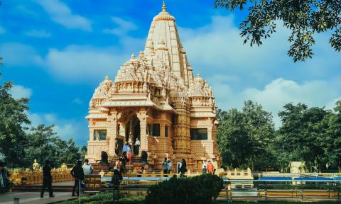 Nepalese Temple Landmark with Trees and Cloudy Sky