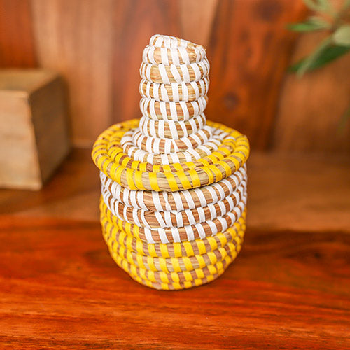 Handmade small yellow and white striped trinket basket from Senegal 