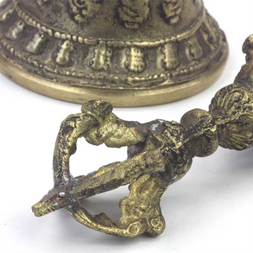 close up of brass dorje bell