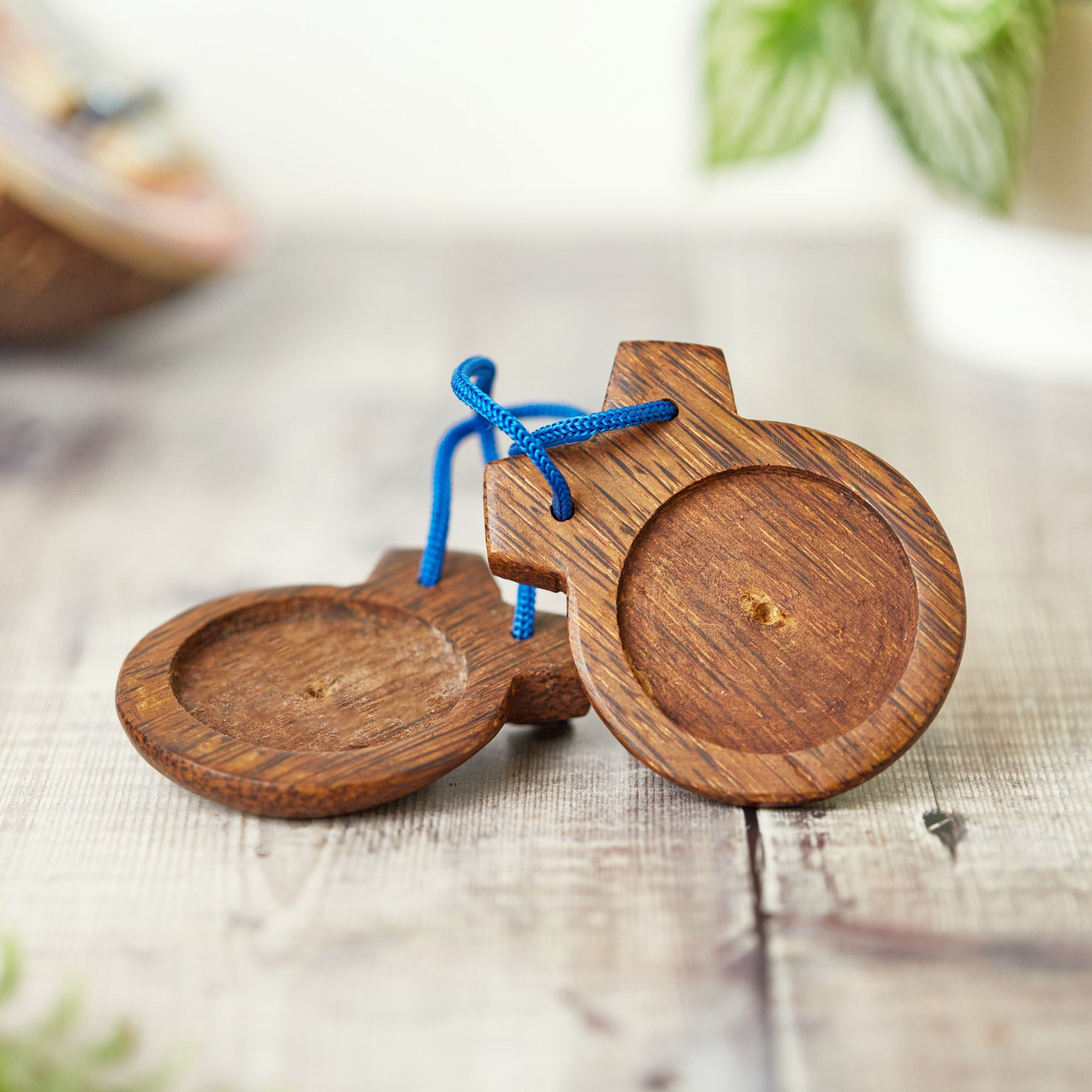 coconut wood castanets on side