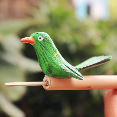 close up wooden bamboo bird flute