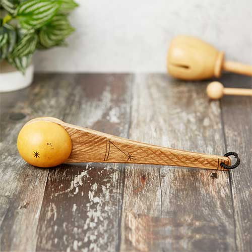 gourd and wood shaker with carvings